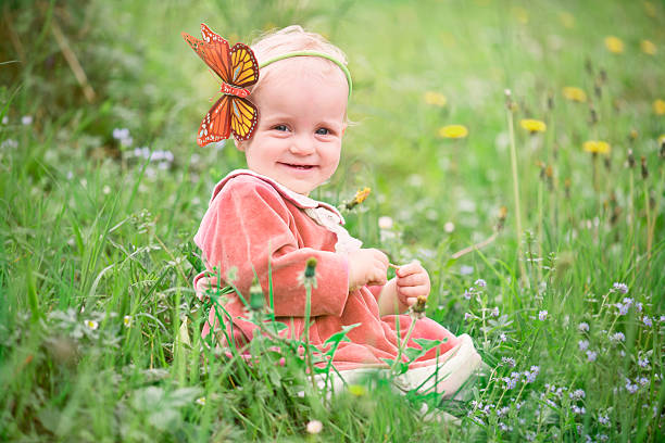 istock Child on the wild flowers field 487335824