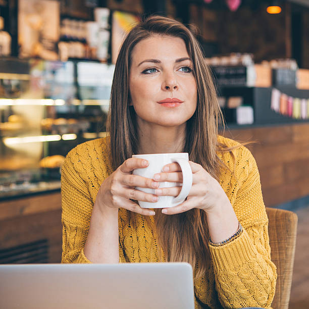 istock Woman with laptop at cafe. 487336208