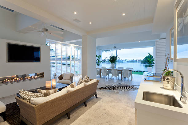 istock Charming living room with a view to a lake 487345586