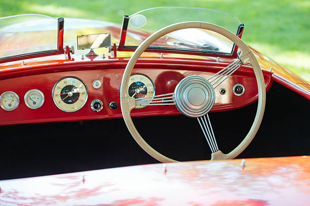 istock Oldtimer sport convertible car with white steering wheel 487346190