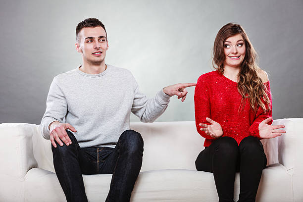 istock Shy woman and man sitting on sofa. First date. 487354992