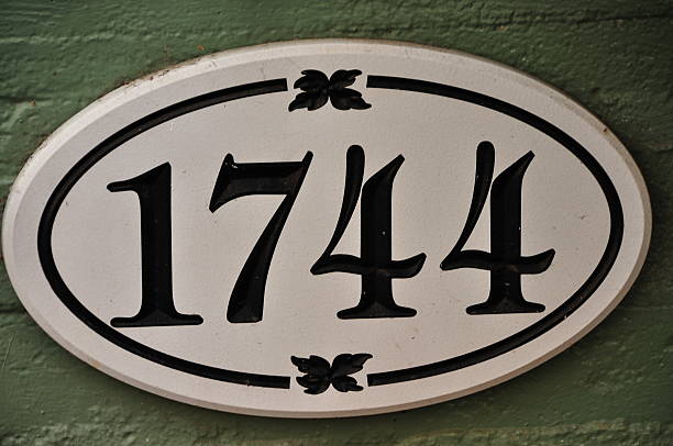 Street address sign number historical year 1744 past stock photo