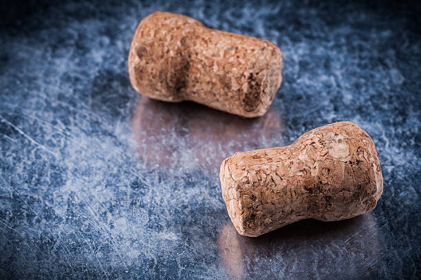 istock Champagne corks on scratched metallic background alcohol concept 487359820