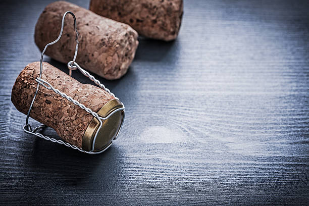 istock copyspace view three corcks of champagne with wires 487359830