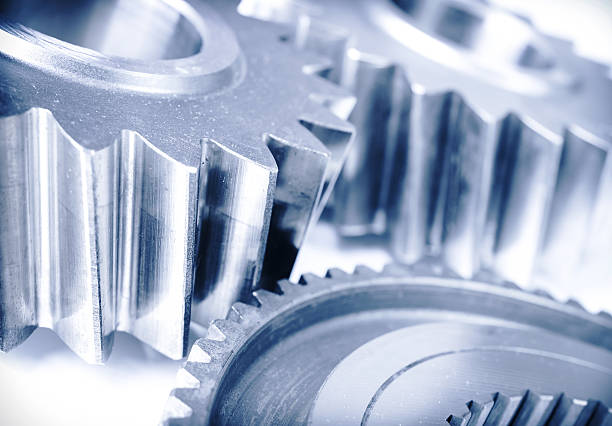 istock Steel cog wheels and transmission machine teeth on isolated background 487359953