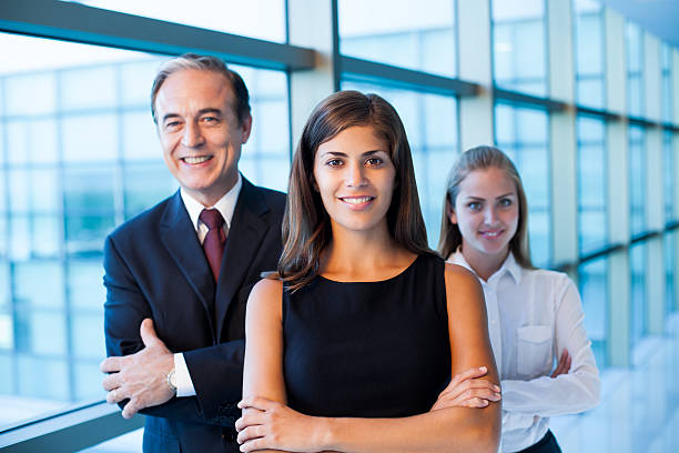 istock Cheerful business team of three in the hall 487360733