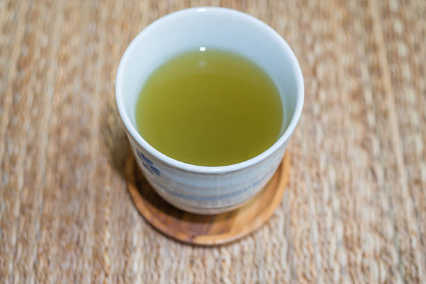 istock cup of hot green tea 487361275