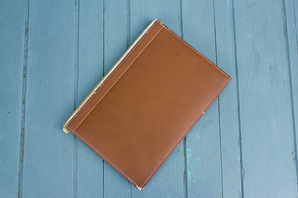 istock hardcover book on wood background 487362612