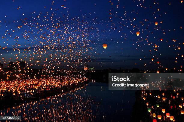 Lots Of Paper Fly Lanterns Next To The River Stock Photo - Download Image Now - Lantern, Sky Lantern, Chinese Lantern Lily