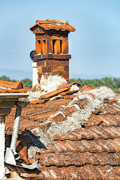 istock red tile roof and stone chimney 487371026