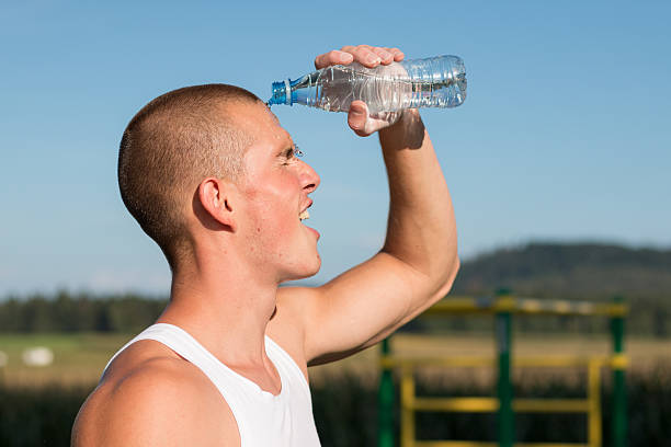 istock Male Athlete Cooling Off With Water 487371156