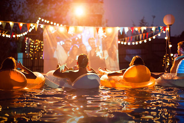 istock Pool movie night party. 487371648