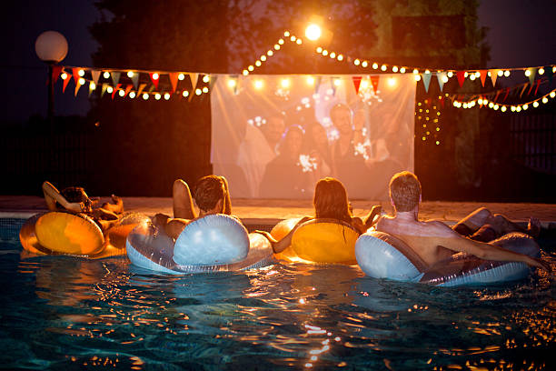 istock Pool movie night party. 487371652