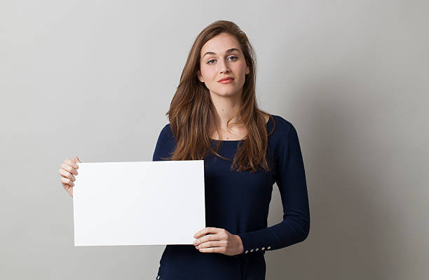 istock thinking 20s girl holding a blank communication 487371720