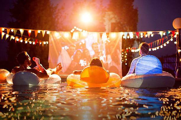 istock Pool movie night party. 487371738