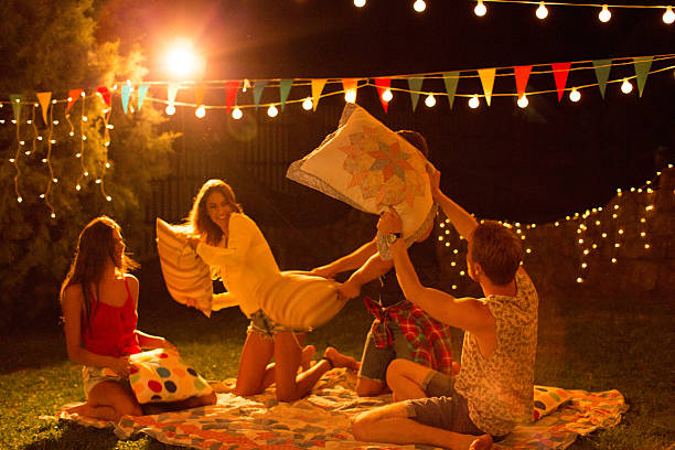istock Pillow fight party outdoors. 487371882