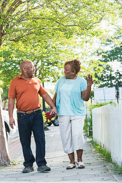 istock Senior black couple taking a walk holding hands 487374340
