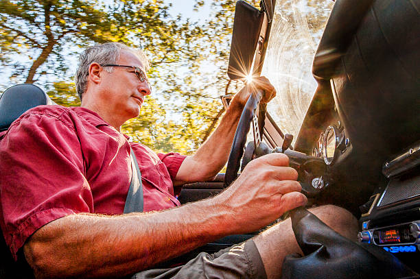 istock Senior Driver in Classic Sports Car 487374950
