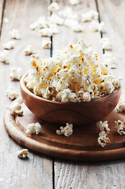 istock Salt popcorn on the wooden table 487376502