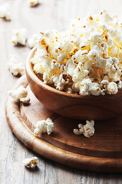 istock Salt popcorn on the wooden table 487376504