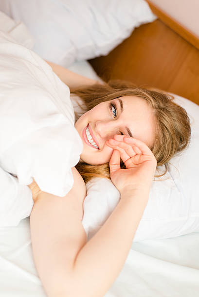 istock Young lady trying to wake up and rubbing her eyes 487378792