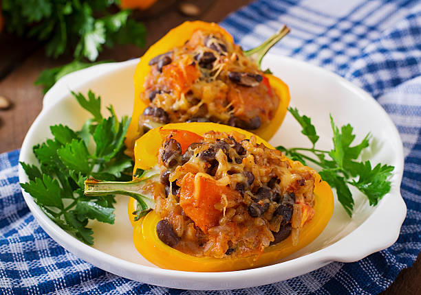 istock Stuffed peppers with rice, beans and pumpkin 487379182