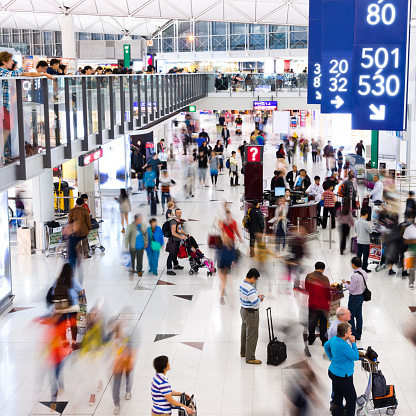 Busy airport with large group of people, hong kong.