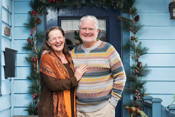 istock Senior couple outside front door 487379650