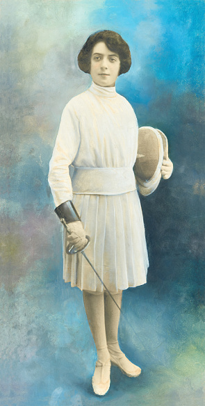 Picture of a 20th century woman with fencing suit.