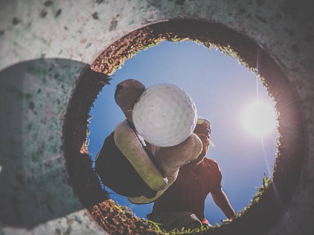 istock Point Of View Golf Player and Ball From Inside Hole 487380220