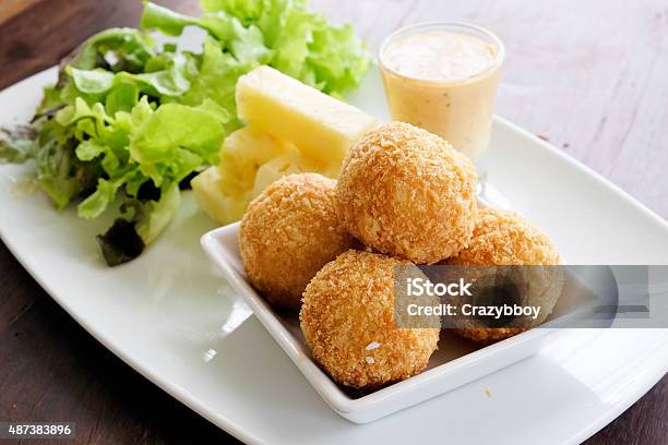 Fried Cheese Ball With Salad In The Dish Stock Photo - Download Image Now - 2015, Appetizer, Breaded