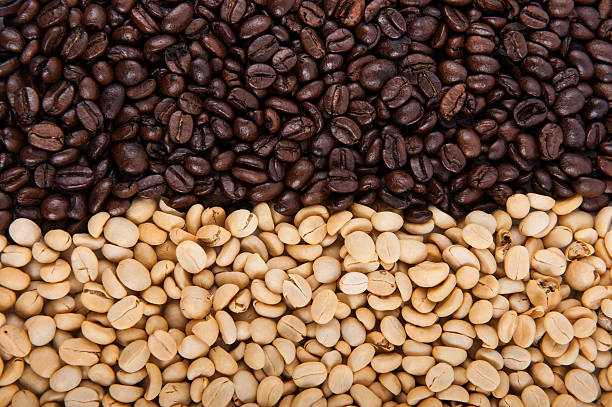 istock Roasted coffee beans pile from top on white background 487388053