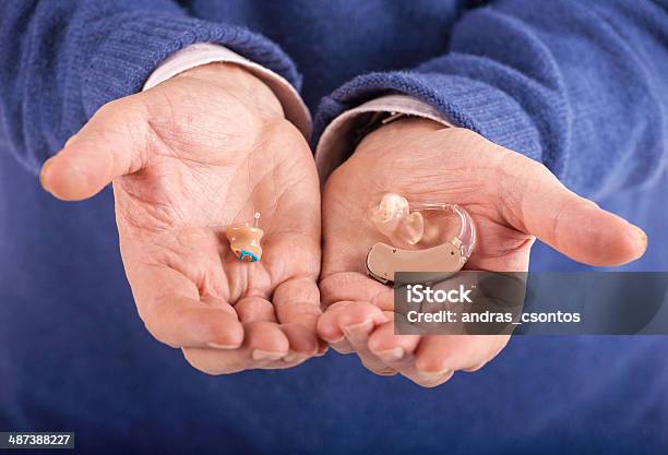 Cic And Bte Hearing Aids Stock Photo - Download Image Now - AIDS, Adult, Audiologist