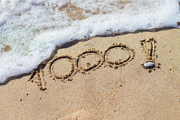istock Numbers 1000 on beach. Milestone post on social media. 487390936
