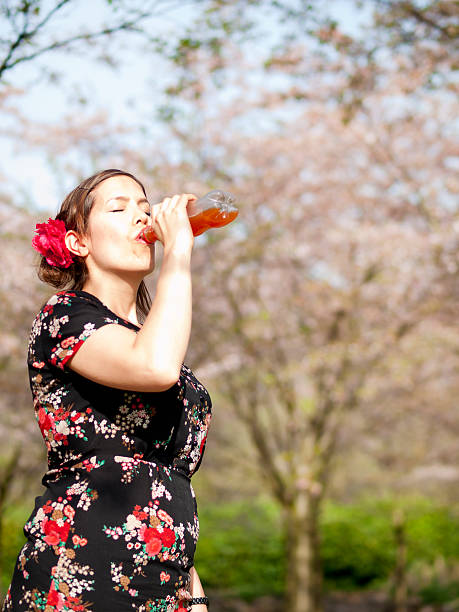 istock Beautiful girl drinking some fruit juice 487391081
