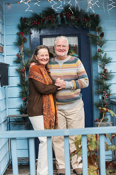 istock Senior couple outside front door 487391258