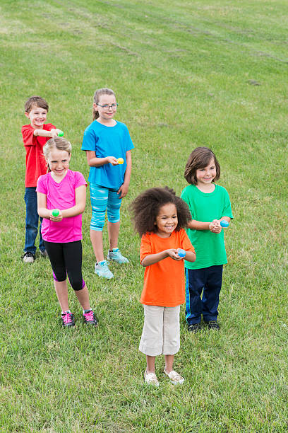 istock Group of children in egg spoon race 487391294