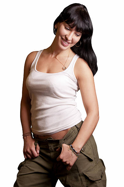 Beautiful white shirt black hair green army pants lady smiling stock photo