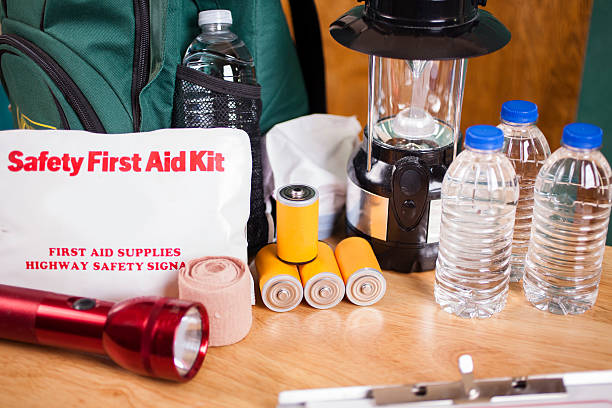 istock Emergency preparedness natural disaster supplies. Water, flashlight, lantern, batteries. 487394896