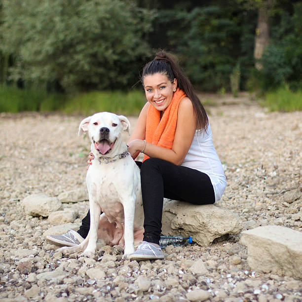 istock Young woman with her dog 487398610