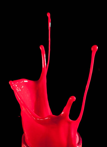 istock splashes of red paint isolated on black background 487399468
