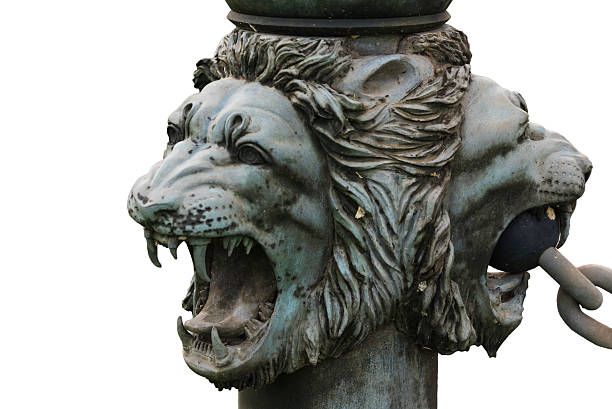 istock bronze lion's head isolated on white background 487402962