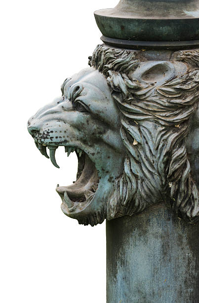 istock bronze lion's head isolated on white background 487402964