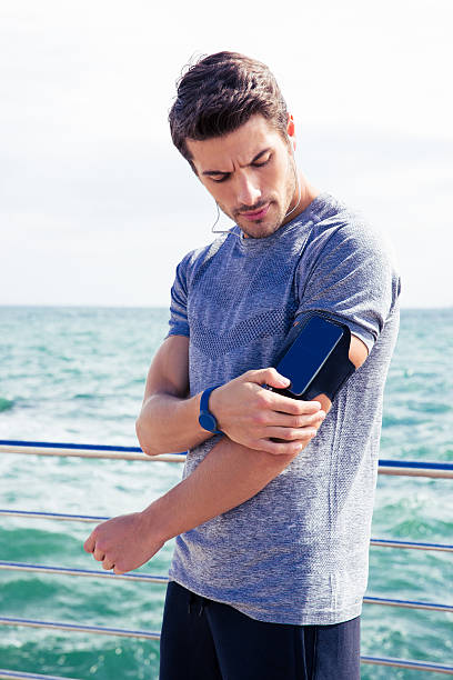 istock Male runner listening to music 487403082