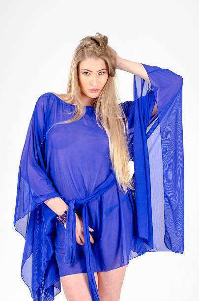 istock Beautiful long-haired blonde in a clear blue tunic 487404150