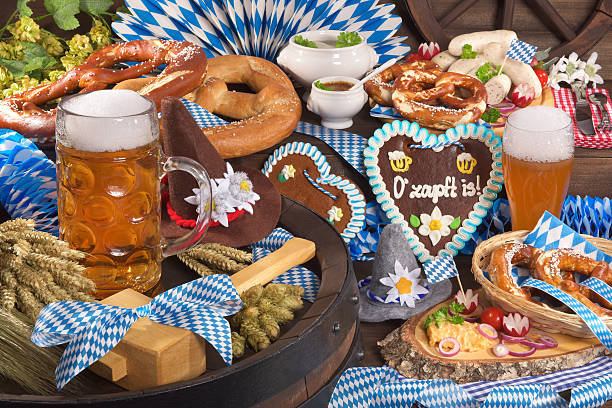 Bavaria and Beer Fest All typical German Bavarian symbols in one picture. Gingerbread heart with „The beer is tapped“ text, soft pretzels, Bavarian veal sausage and beer. oktoberfest food stock pictures, royalty-free photos & images