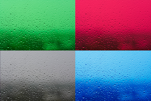 Green, red, gray and blue water drops