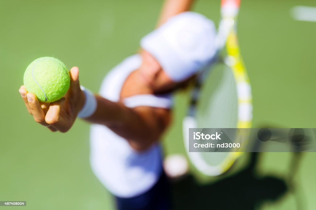 Beautiful female tennis player serving Beautiful female tennis player serving outdoor and a closeup of the serve from above Tennis Stock Photo
