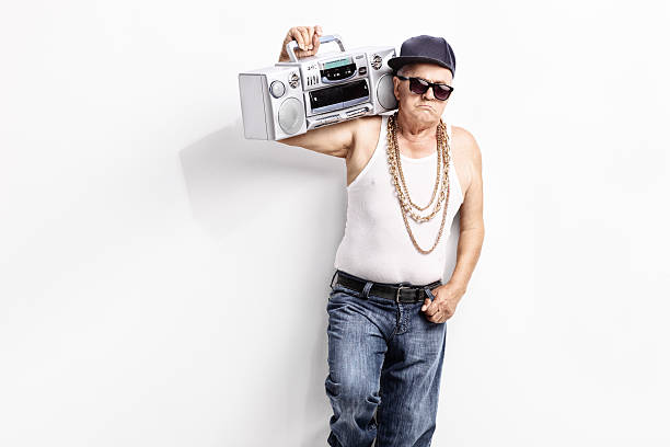 istock Senior rapper carrying a ghetto blaster 487408034