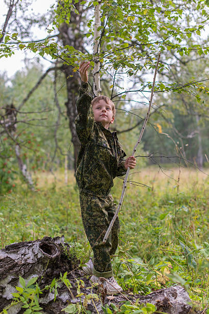 istock Woman collecting mushrooms 487408408